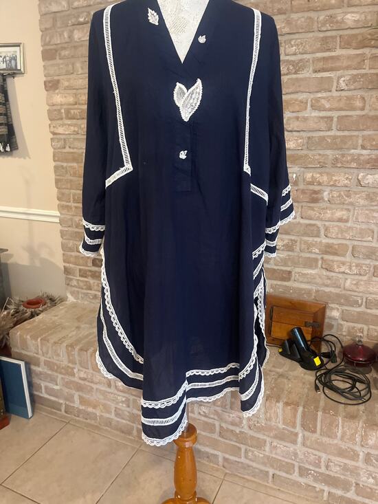 None Dresses & Skirts - Navy tunic featuring intricate floral lace trim on neckline, hem & sleeves.